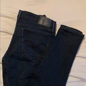 Levi Strauss size 29 black jeans with ripped knee
